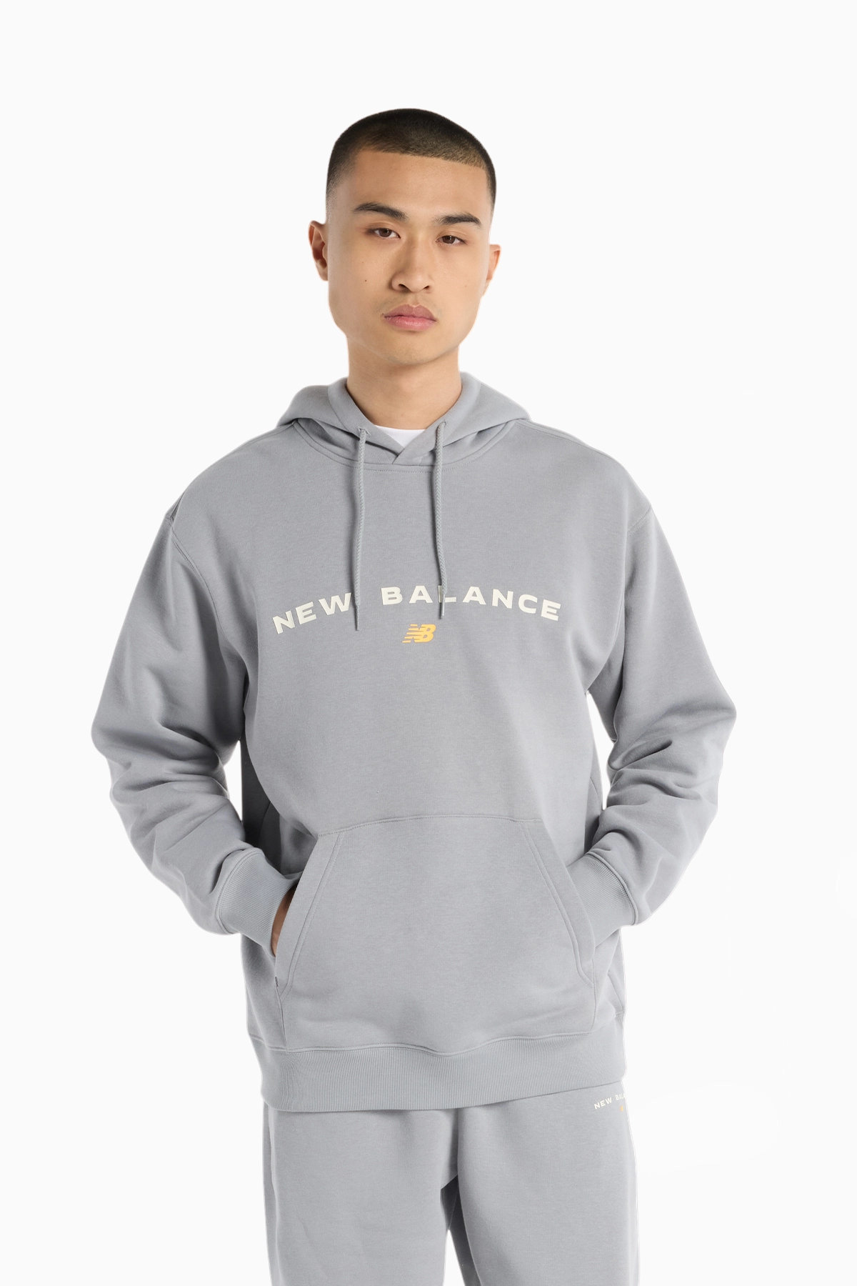 Bluza z kapturem New Balance Reimagine Fleece Graphic - Szary