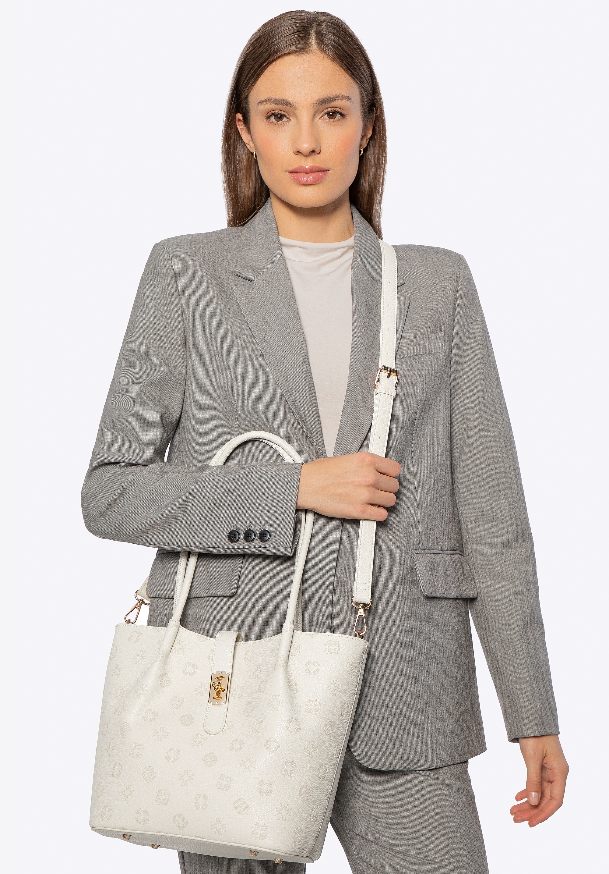 Damski kuferek z ekoskóry z tłoczoną sygnaturą duży kremowy