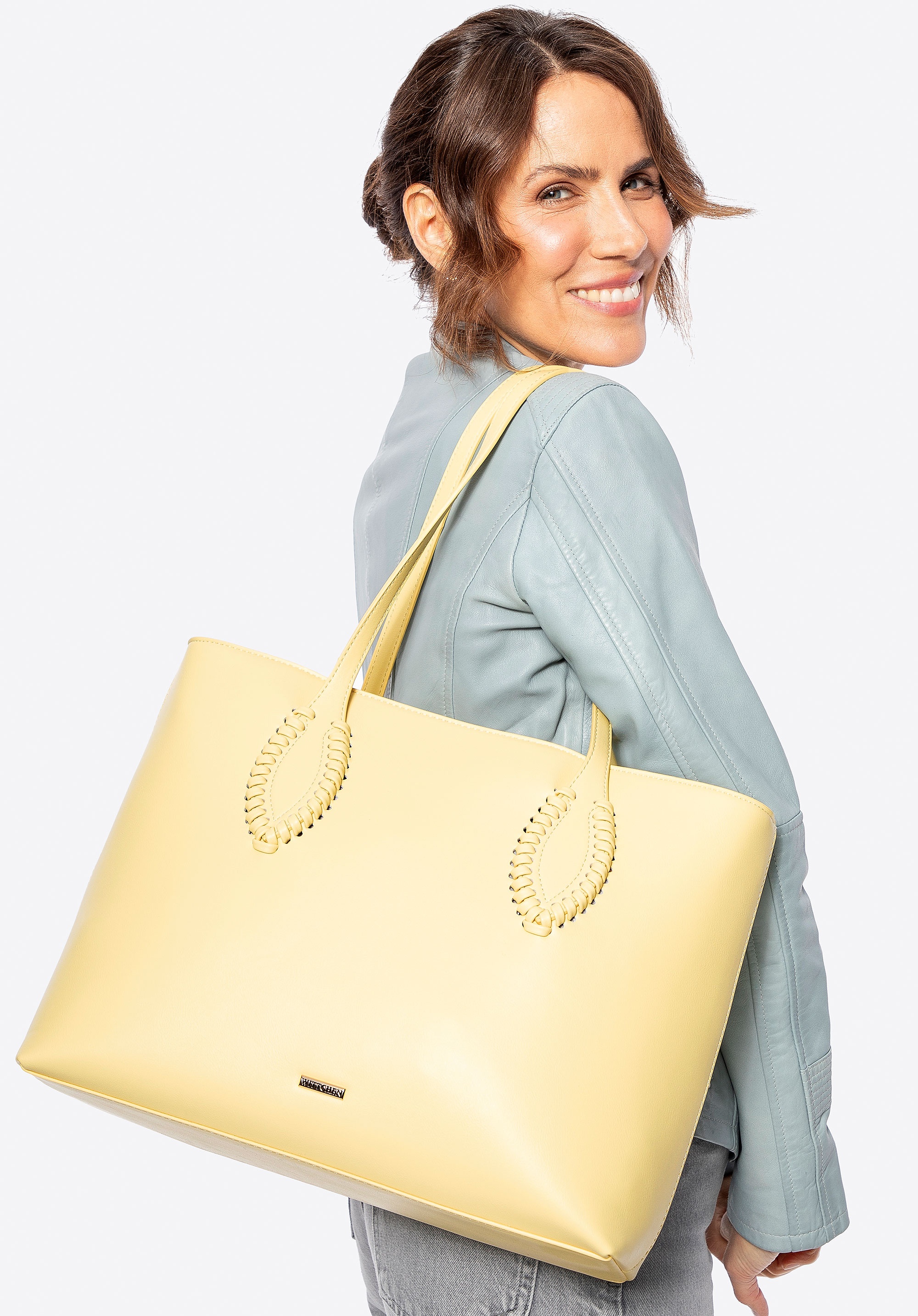 Damska shopperka ze skóry ekologicznej z plecionymi akcentami żółta