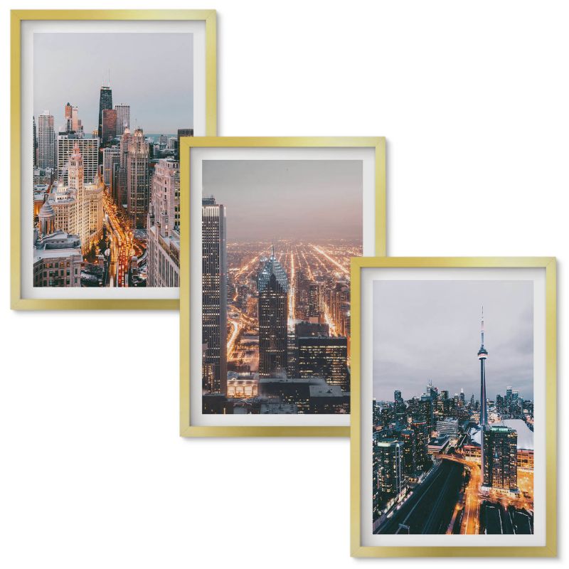 Obraz Ścienny Zestaw Wallfluent Miasta nocą wieżowce światła Złota rama 40x60 cm 3 szt.