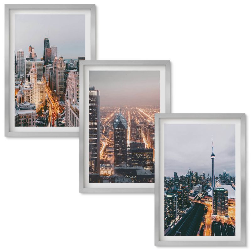 Obraz Ścienny Zestaw Wallfluent Miasta nocą wieżowce światła Srebrna rama 40x60 cm 3 szt.