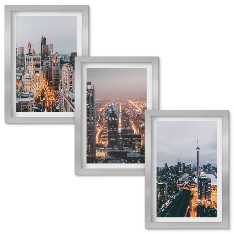 Obraz Ścienny Zestaw Wallfluent Miasta nocą wieżowce światła Srebrna rama 20x30cm 3 szt.